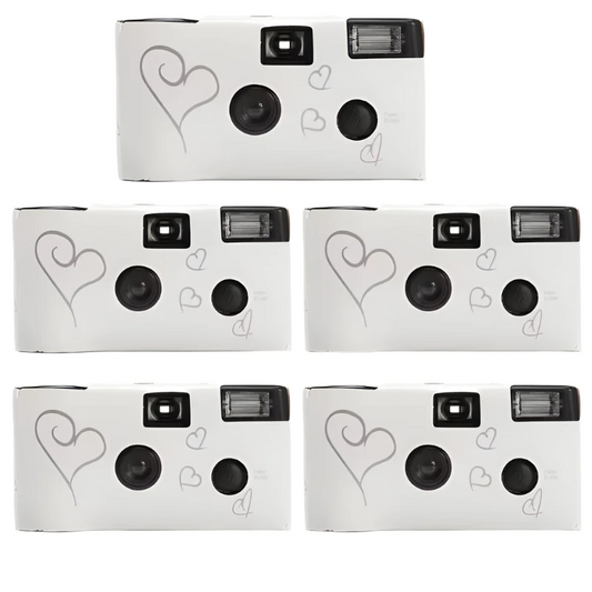 Five white disposable cameras with heart designs on a white background
