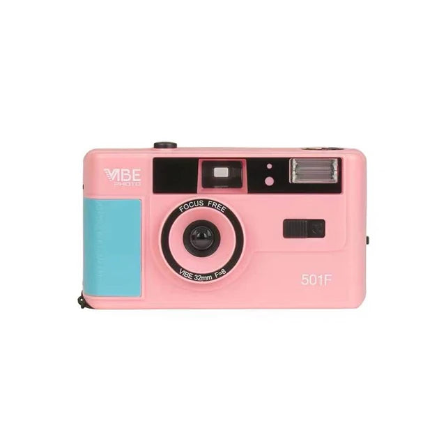 Pink camera with a blue panel on a white background